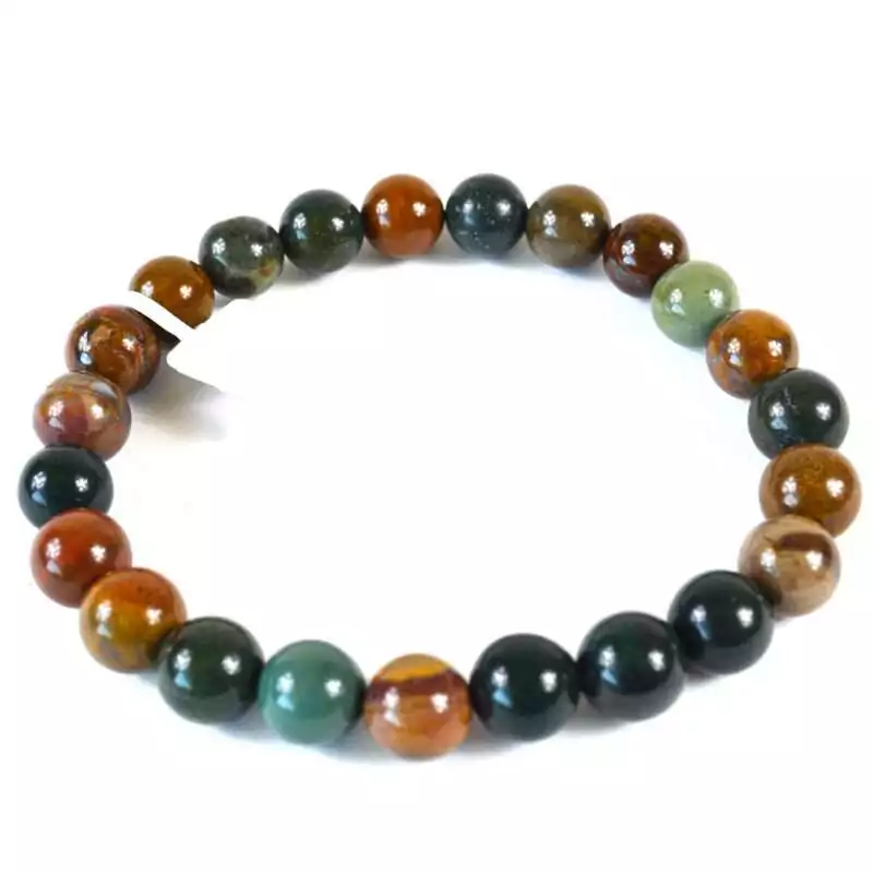 8mm ocean jasper beaded stretch bracelet with multicolor orbicular pattern beads in greens, pinks, and creams on elastic cord, shown on plain surface