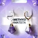 Pair of amethyst crystal stone drop earrings with silver-toned click hoop closures displayed on a white background