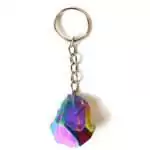 Natural amethyst crystal keychain with vibrant full-spectrum rainbow metallic plating showing multicolor reflections on a white background