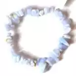 Natural blue lace agate chip bracelet on stretch cord with pale blue and white banded stone chips displayed on a white background