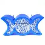 A blue wax Triple Moon figure candle with waxing crescent, full circle, and waning crescent moon symbols embossed on the front in rich deep blue wax with smooth finish