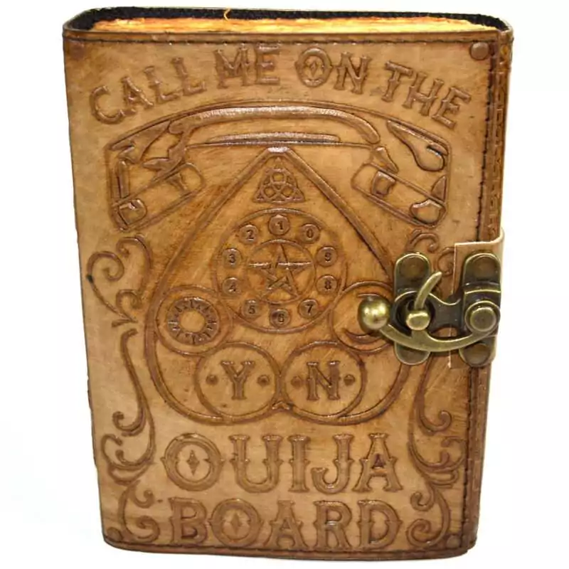 Call-Me-on-the-Ouija-Board-aged-looking-paper-leather-w-latch-BBBL3530 Dark faux leather journal with metal latch featuring an embossed ouija board design on the cover with planchette motif and aged interior pages