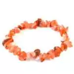 Natural carnelian chip bracelet on stretch cord showing rough orange, red, and amber polished stone chips against a white background