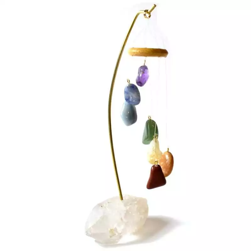 Chakra-W-Quartz-base-table-chime-FW016 Seven-rod chakra table chime with natural quartz crystal base, rainbow-colour coded rods arranged vertically, shown freestanding on plain surface