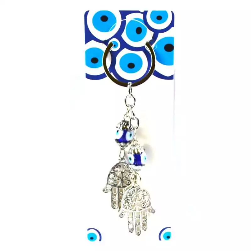 Double-Hand-of-Fatima-evil-eye-keychain-JK032 Double Hand of Fatima evil eye keychain with two hamsa charms and a blue nazar evil eye bead on a metal ring displayed on a white background