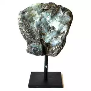 Raw natural emerald crystal mounted on a matte black display stand, showing green mineral cluster with visible crystalline structure on a neutral background
