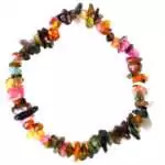 Natural rainbow tourmaline chip bracelet on stretch cord with rough multicolor green, pink, and black tourmaline stone chips on a white background