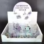 Set of 20 small miner figurines each mounted on natural purple amethyst crystal bases, displayed in a group showing varied amethyst cluster sizes