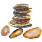 Set of 25 natural banded agate slices ranging 2 to 4 inches, showing translucent layers of white, brown, and grey tones arranged on a flat surface