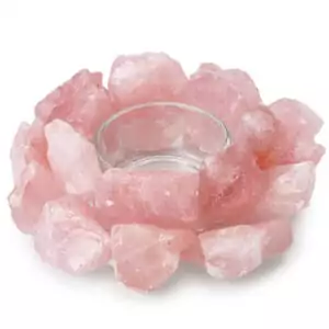 A 4.5-inch natural rose quartz tealight holder with soft pink coloring and natural inclusions, showing a circular carved center cavity for tealight candle placement