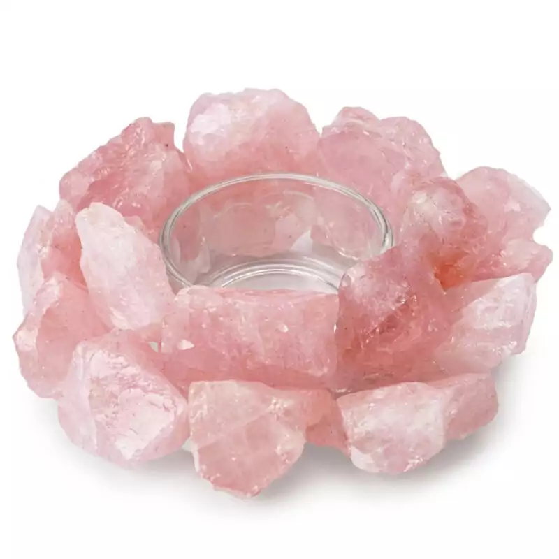 4-12quot-Rose-Quartz-tealight-holder-CH006_Z A 4.5-inch natural rose quartz tealight holder with soft pink coloring and natural inclusions, showing a circular carved center cavity for tealight candle placement
