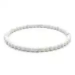 4mm white howlite beaded stretch bracelet with chalky white and grey-veined round beads on elastic cord, laid flat on plain surface