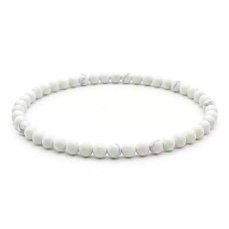 4mm-Howlite-White-JB4327_Z 4mm white howlite beaded stretch bracelet with chalky white and grey-veined round beads on elastic cord, laid flat on plain surface
