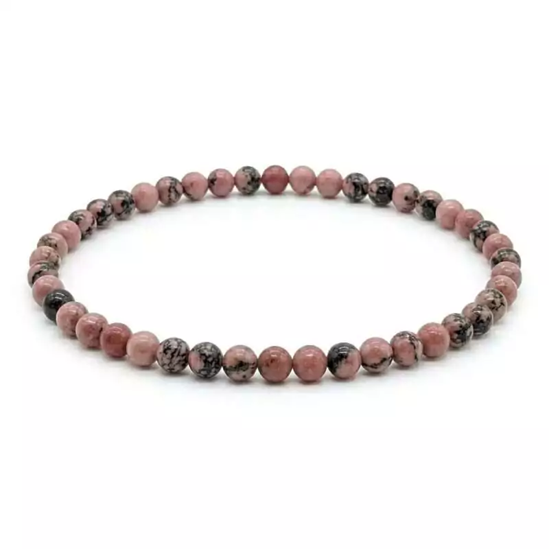 4mm-Rhodonite-JB4587_Z_1 4mm rhodonite beaded stretch bracelet with rose-pink and black-veined round beads on elastic cord, shown on neutral surface