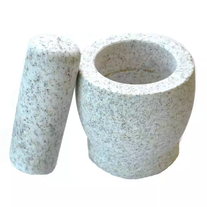 4-inch all-natural granite mortar and pestle set with the pestle resting beside the bowl, showing the natural grey stone texture and smooth interior — heavy-duty herb grinding tool for ritual and apothecary use