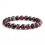 Eight millimeter eudialyte beaded stretch bracelet with mottled deep pink, red, and black rare mineral stone beads on a white background