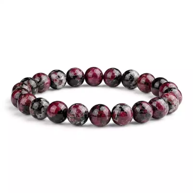 8mm-Eudialyte-JB8848_Z Eight millimeter eudialyte beaded stretch bracelet with mottled deep pink, red, and black rare mineral stone beads on a white background