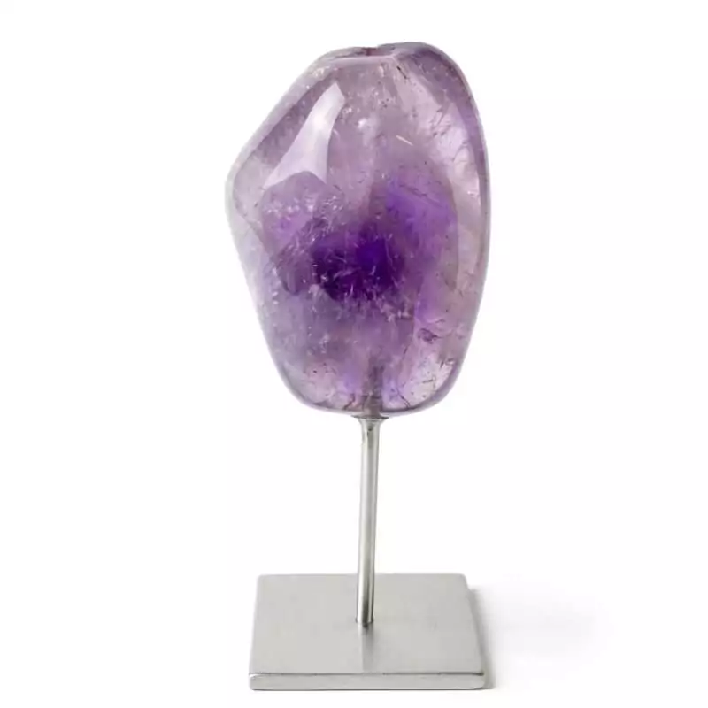 Amethyst-on-silver-stand-GS022_Z_1 Natural purple amethyst crystal cluster mounted on a decorative silver-toned stand, displaying deep violet crystal points against a white background