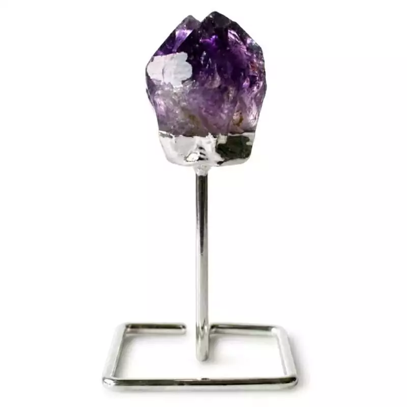 Larger natural amethyst crystal cluster with multiple deep purple points mounted on a silver-toned display stand on a white background