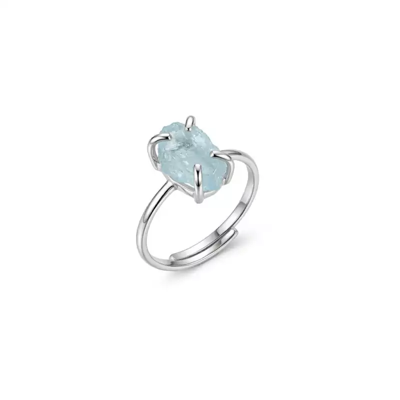 Aquamarine-adjustable-ring-JR023_Z Aquamarine adjustable crystal ring with a soft blue stone set on an open silver-toned band displayed on a white background