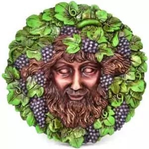 5 inch wall plaque depicting Bacchus the Roman god of wine with grape and vine motifs in relief sculpture