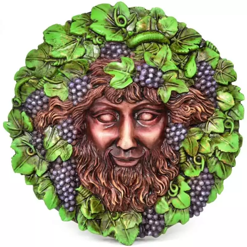 5 inch wall plaque depicting Bacchus the Roman god of wine with grape and vine motifs in relief sculpture
