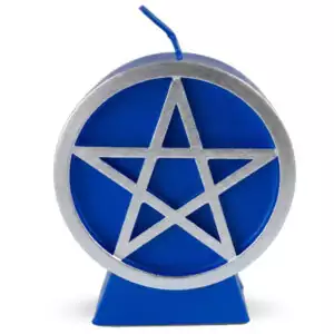 A blue wax pentacle figure candle with a five-pointed star in a circle embossed on the front, showing a deep blue color with smooth wax finish