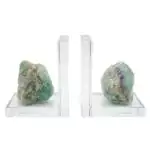 Matched pair of natural fluorite slab bookends with multicolour purple, green, and clear banding, shown supporting books on plain surface