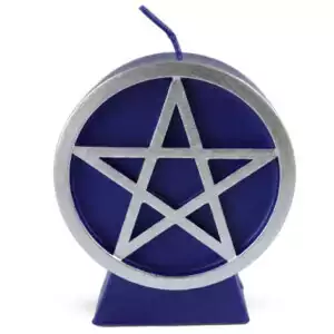 A purple wax pentacle figure candle with a five-pointed star in a circle embossed on the front face, showing deep violet-purple wax with a smooth finish