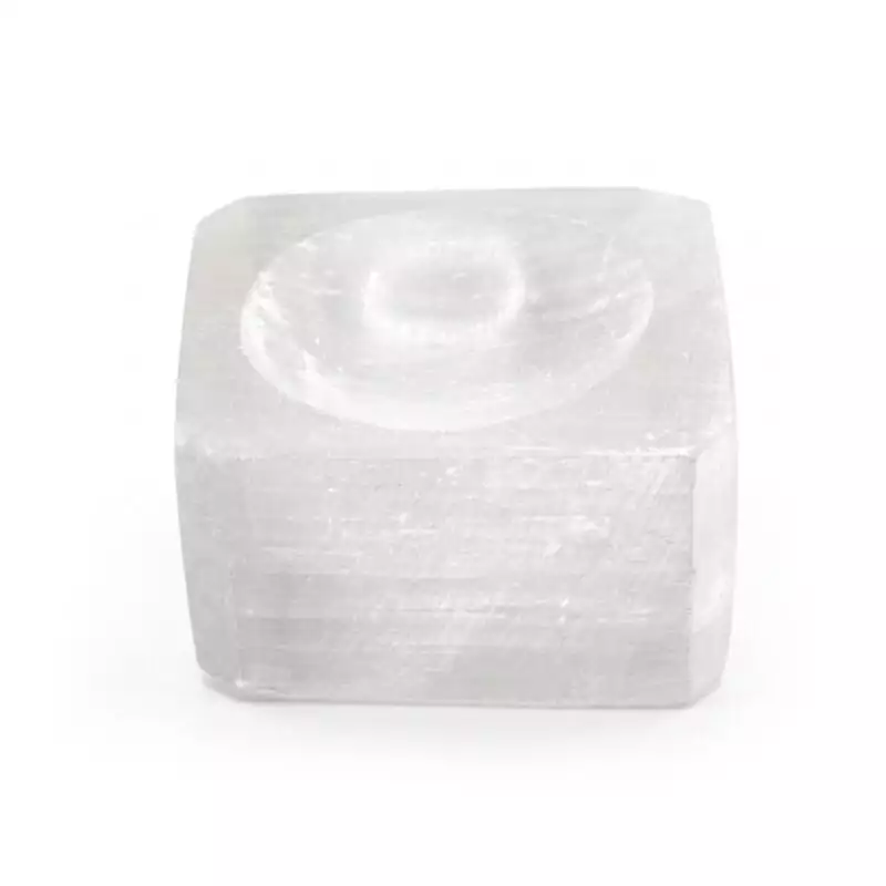 Small natural white selenite ring stand carved to cradle a gazing crystal sphere, showing fibrous pearlescent selenite texture on plain background