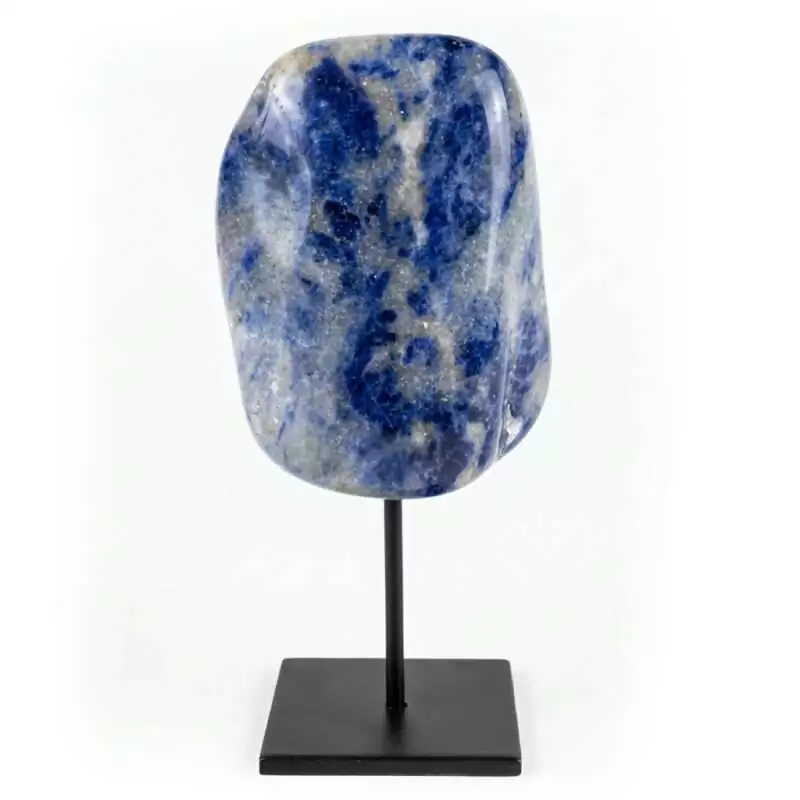 Natural deep blue sodalite crystal with white calcite veining mounted on a matte black display stand against a white background