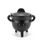 2.75-inch black cast iron cauldron with triple moon crescent relief on the body and a fitted lid, three-legged base, shown on neutral background