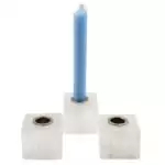 Set of three natural selenite crystal chime candle holders arranged together, showing white fibrous selenite with cylindrical tops sized for chime candles