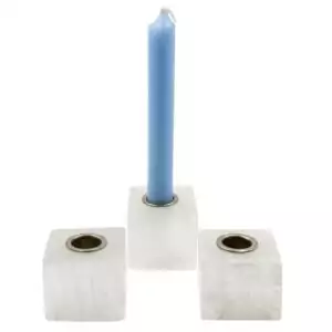 Set of three natural selenite crystal chime candle holders arranged together, showing white fibrous selenite with cylindrical tops sized for chime candles