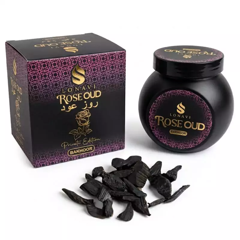 40gms-Rose-Oud-Sonavi-IBERO40_Z Black jar labeled Rose Oud next to its decorative box, with small oud wood pieces — Sonavi 40g rose and agarwood bakhoor chips for love ritual.