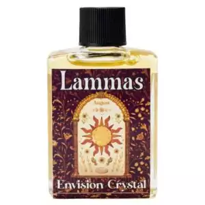Lammas 4 dram anointing oil bottle from Envision Crystal — warm sun and floral label, black cap, golden oil inside. Used for first harvest sabbat candle anointing, ritual, and personal wear.
