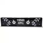 Black incense box labeled Poison Apple, Sweet Apple Incense, Organic Vegan, 15 Incense Sticks, decorated with white skull-and-crossbones apple illustrations, leaf branches, and stars.