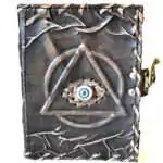 5 by 7 inch vintage-style leather journal with circle, triangle, and Evil Eye design and latch closure