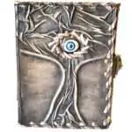 5 by 7 inch handcrafted leather journal embossed with Tree of Life and Evil Eye design, latch closure
