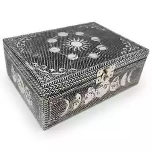 5 by 7 inch wood box with a hand-carved metal moon phase design, velvet lined with a secure latch