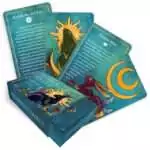 Prosperity Spells card deck by Judika Illes showing the boxed set and a fan of gilt-edged cards with gold-trimmed illustrated spell cards for wealth and abundance magic