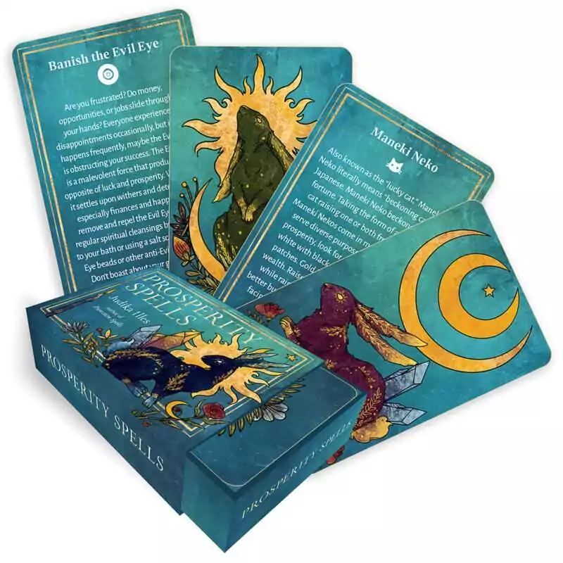 Prosperity Spells card deck by Judika Illes showing the boxed set and a fan of gilt-edged cards with gold-trimmed illustrated spell cards for wealth and abundance magic