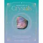 Hardcover Sacred Art of Crystals by Judy Hall and Rachel Hancock open to a crystal grid layout page