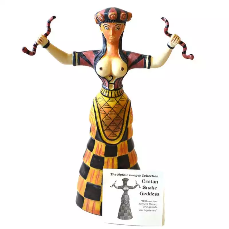 10quot-Cretan-Snake-Goddess-SC563 Cretan Snake Goddess statue: a painted figure with raised arms and a snake in each hand, a banded crown, and a black and yellow checked skirt, with a small card reading Cretan Snake Goddess.