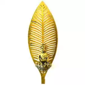 Buddha wall decor: a gold-toned leaf-shaped wall hanging cut with slatted veins, with a small seated Buddha on a lotus-petal tealight cup at its base.