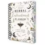 Spiral-bound Llewellyn's 2027 Herbal Enchantment Planner, a green guide to plant magic, with a cream cover of leaves, crescent moons and moths and colored month tabs down the edge.