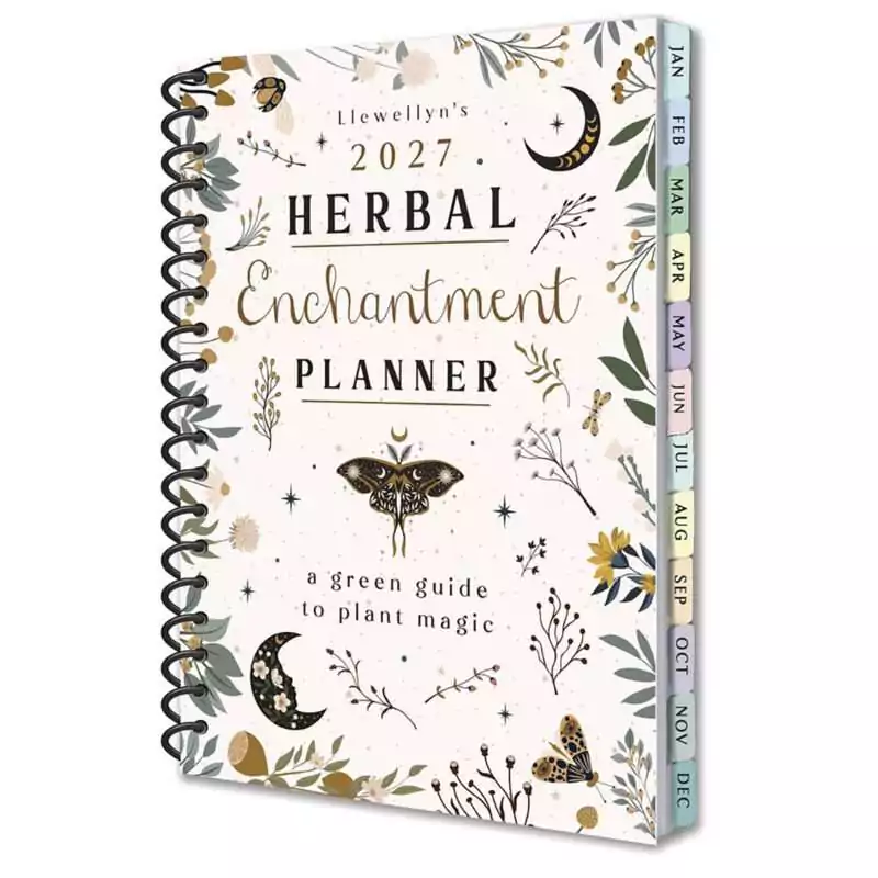 Spiral-bound Llewellyn's 2027 Herbal Enchantment Planner, a green guide to plant magic, with a cream cover of leaves, crescent moons and moths and colored month tabs down the edge.