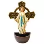 Lady of Grace holy water font: Mary in a white hooded robe with a turquoise sash and open arms before a gold-toned ringed cross, above a bronze-toned half-round basin.