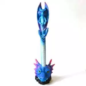 Blue dragon pen standing in a royal blue dragon-head holder with magenta horns, a cobalt winged dragon with violet wings on top, and a pale blue barrel, on white