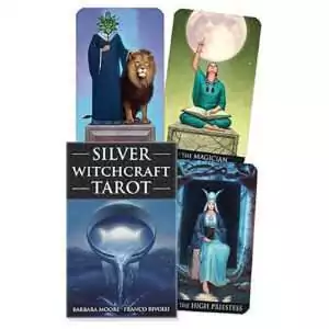 Silver Witchcraft Tarot box by Barbara Moore and Franco Rivolli with a silver bowl pouring water at dusk, beside The Magician, The High Priestess and a robed figure with a lion